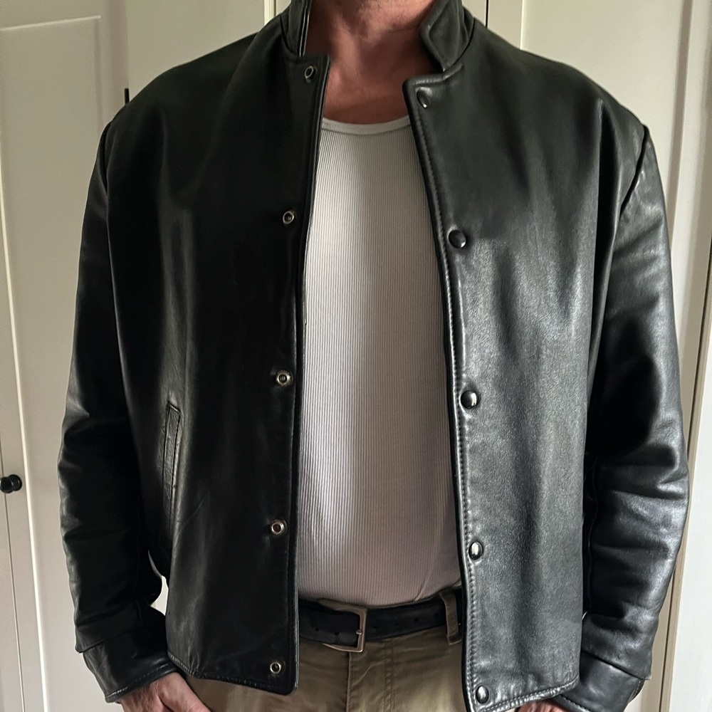 Leather coat made in Canada. Motorcycle style tab collar. Great condition.